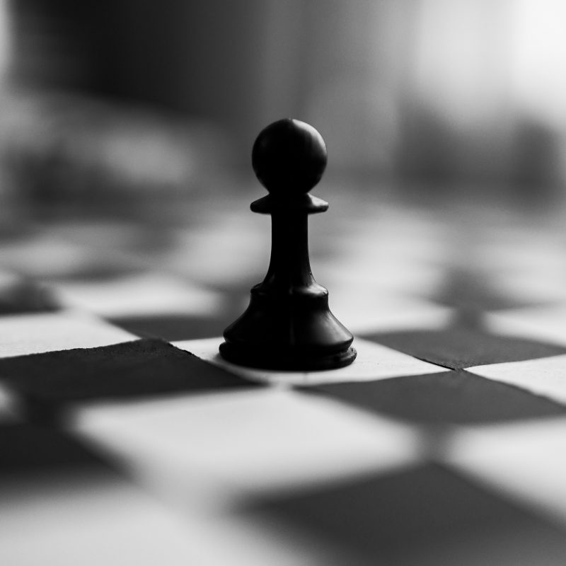 image depicts one chess pawn in the middle of a chessboard
